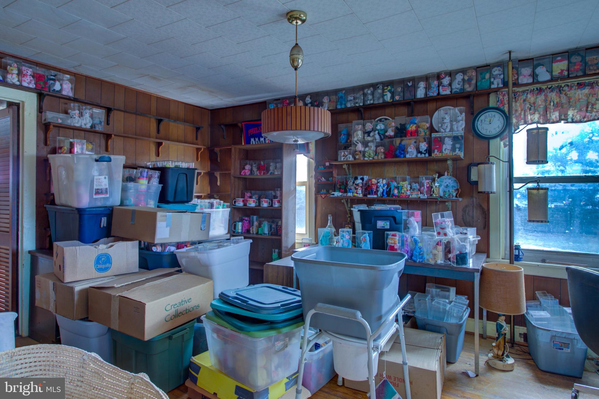 193 Cochran Street Cochranville, PA 19330 - Photo 17 of 57 a living room with furniture and a book shelf