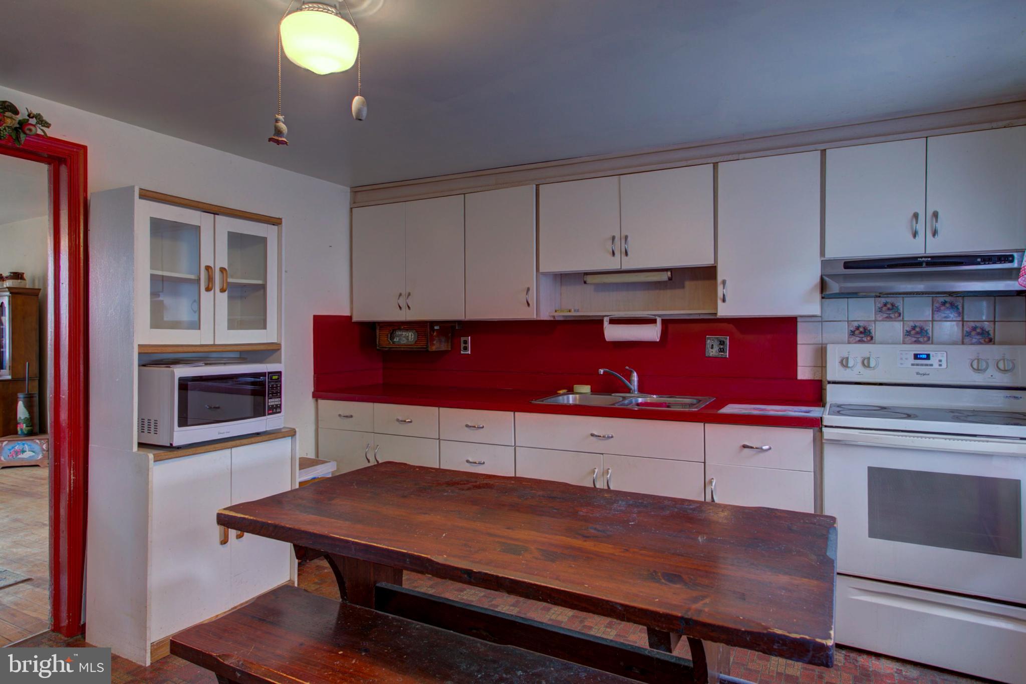 193 Cochran Street Cochranville, PA 19330 - Photo 20 of 57 a kitchen with stainless steel appliances granite countertop a stove a cabinets and a sink
