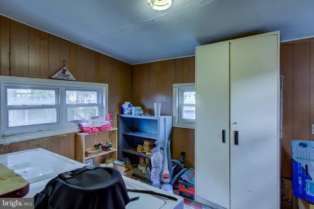 a room with furniture and air conditioner vent