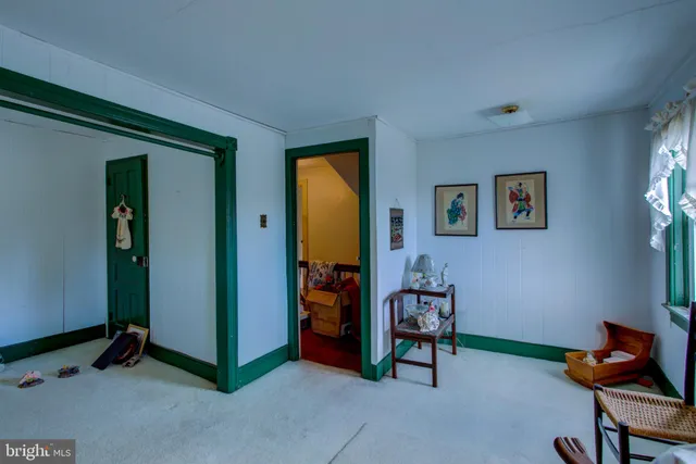 a bathroom with a granite countertop bathtub shower and toilet
