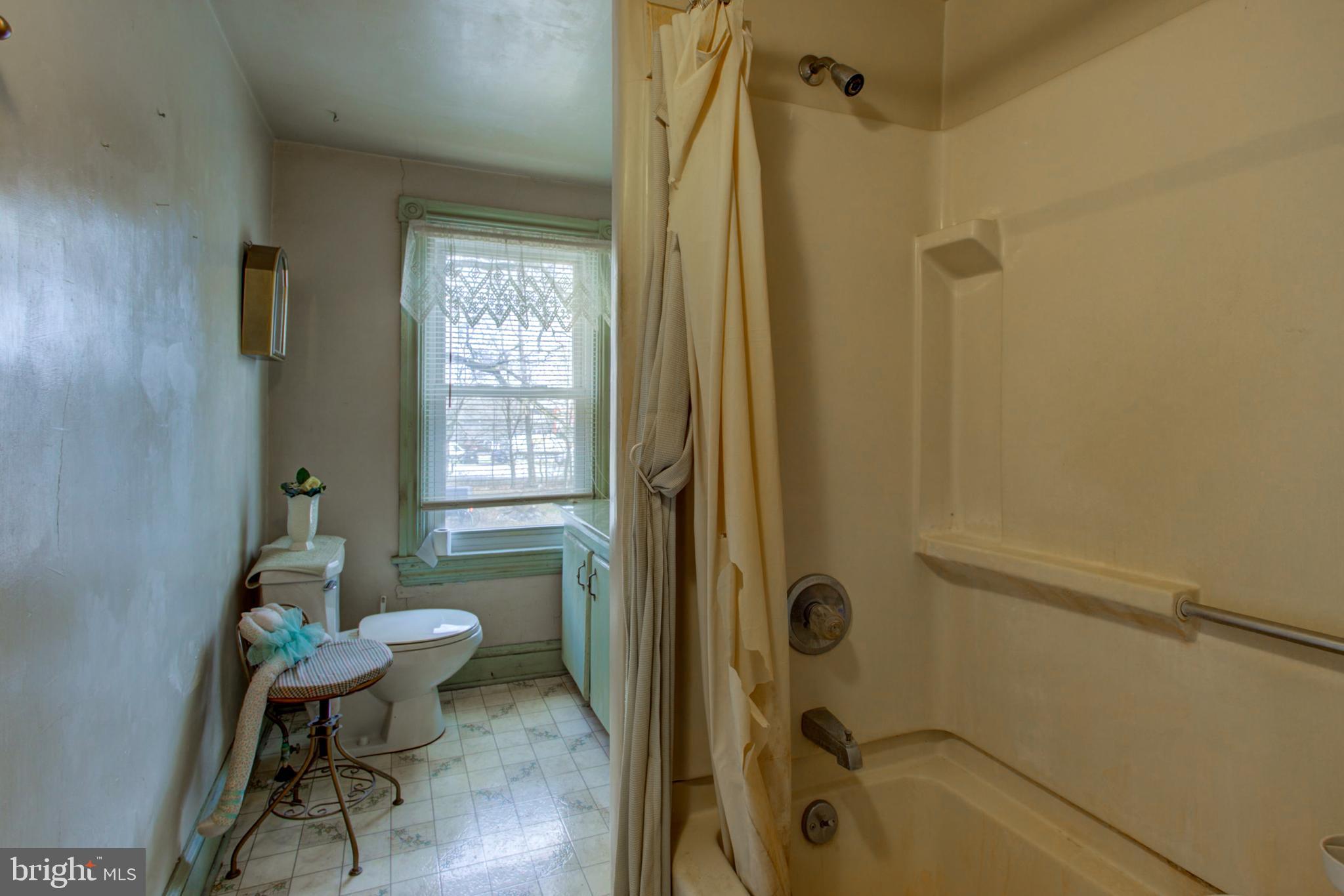 193 Cochran Street Cochranville, PA 19330 - Photo 32 of 57 a bathroom with a granite countertop bathtub shower and toilet