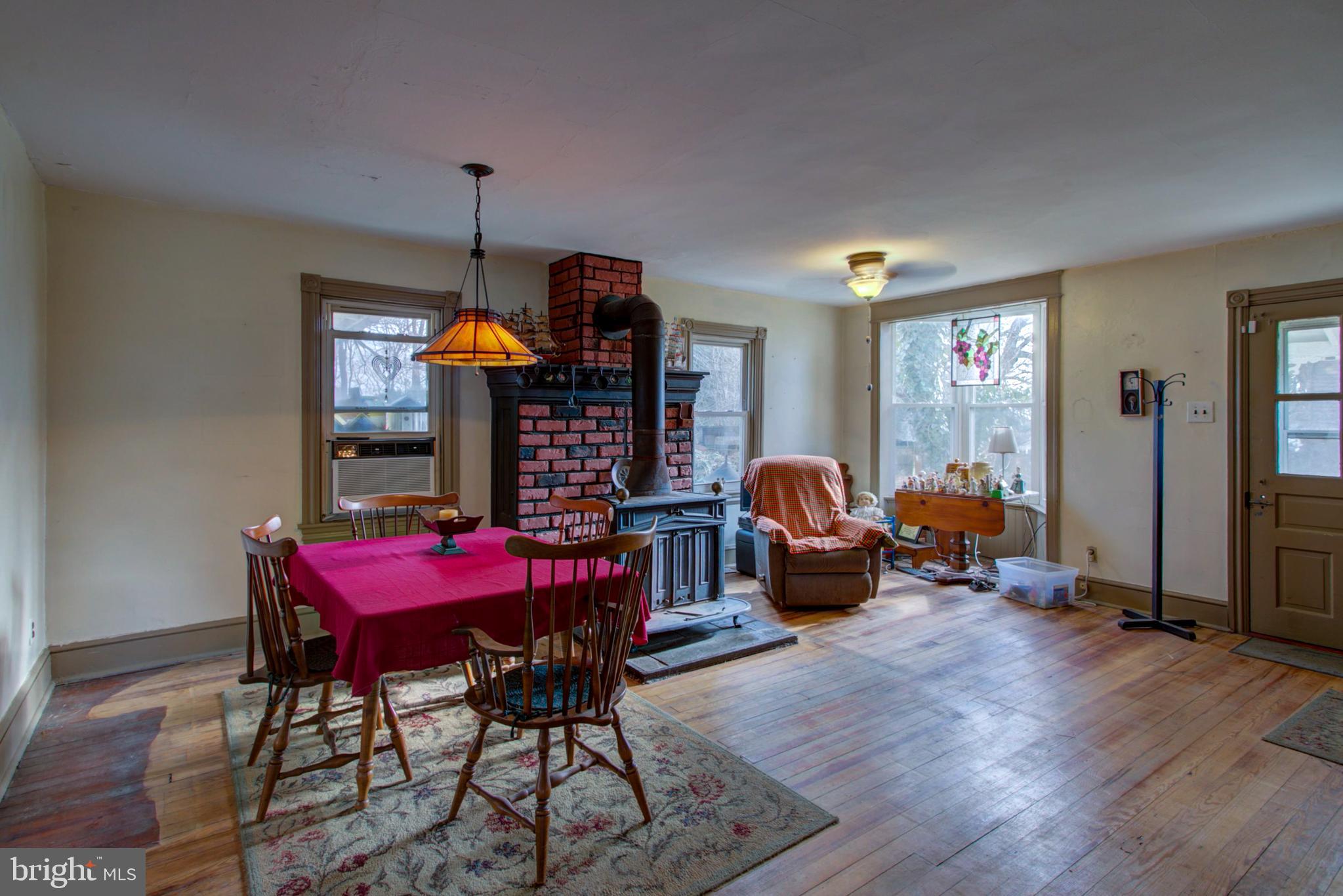 193 Cochran Street Cochranville, PA 19330 - Photo 40 of 57 a living room with furniture a couch and large windows