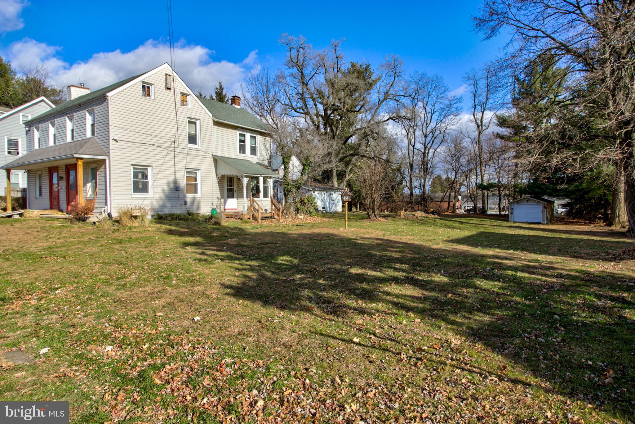 193 Cochran Street Cochranville, PA 19330 - Photo 45 of 57 a front view of residential houses with yard and trees