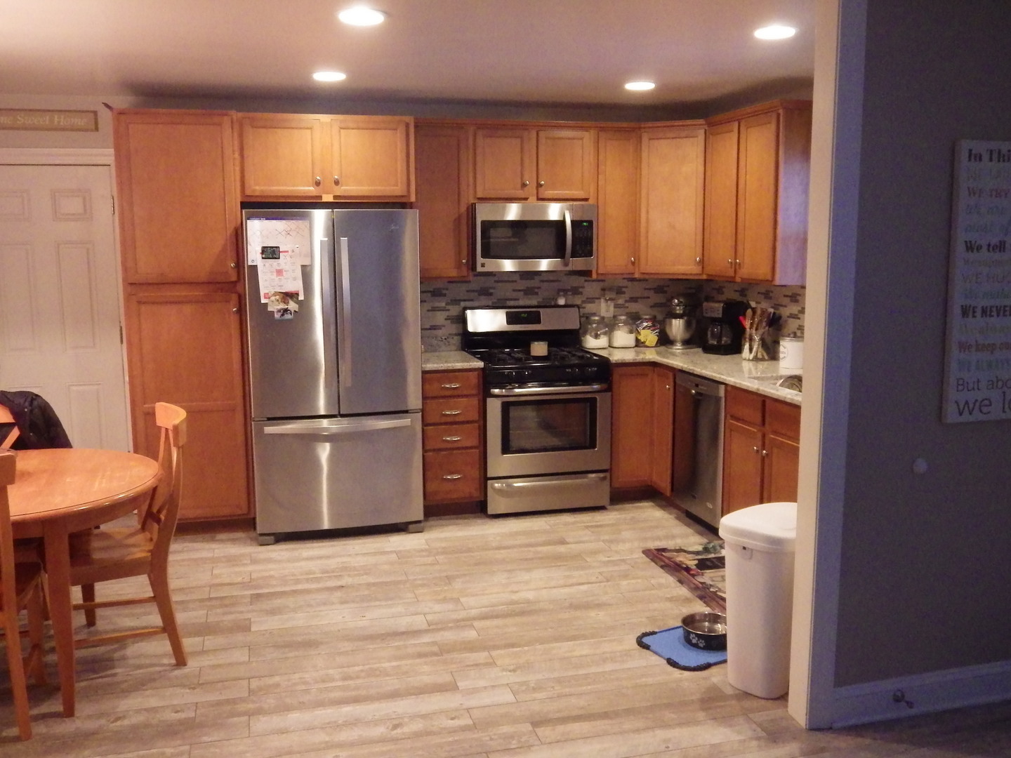 813 Southgate Road New Lenox, IL 60451 - Photo 4 of 17 a kitchen with stainless steel appliances granite countertop a refrigerator sink and microwave