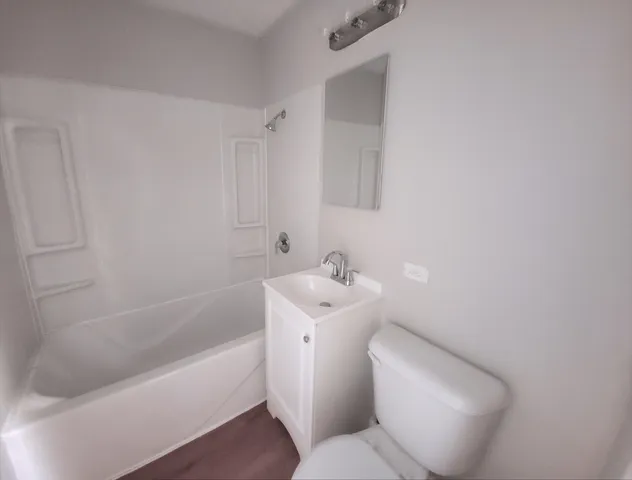 a bathroom with a toilet sink and bathtub