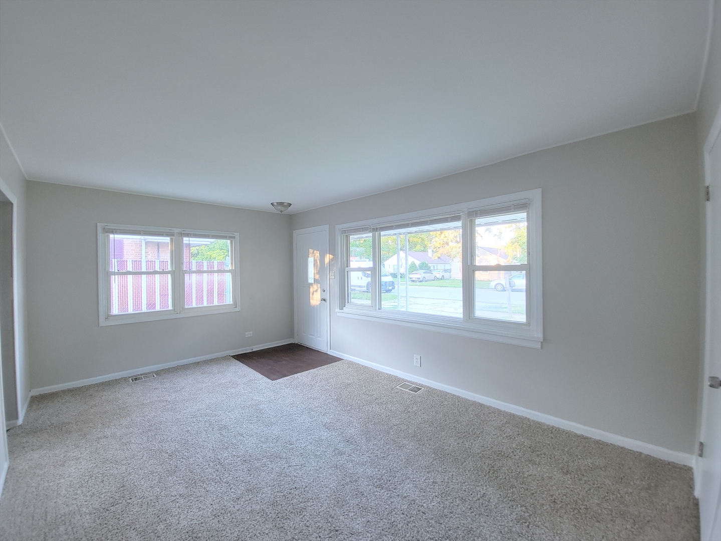 14610 Sawyer Avenue Midlothian, IL 60445 - Photo 4 of 18 an empty room with windows