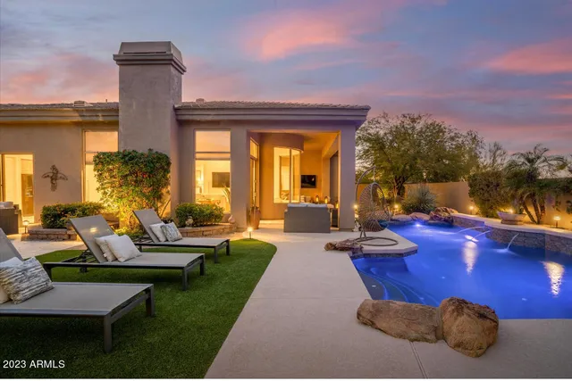 a view of a swimming pool and lounge chair