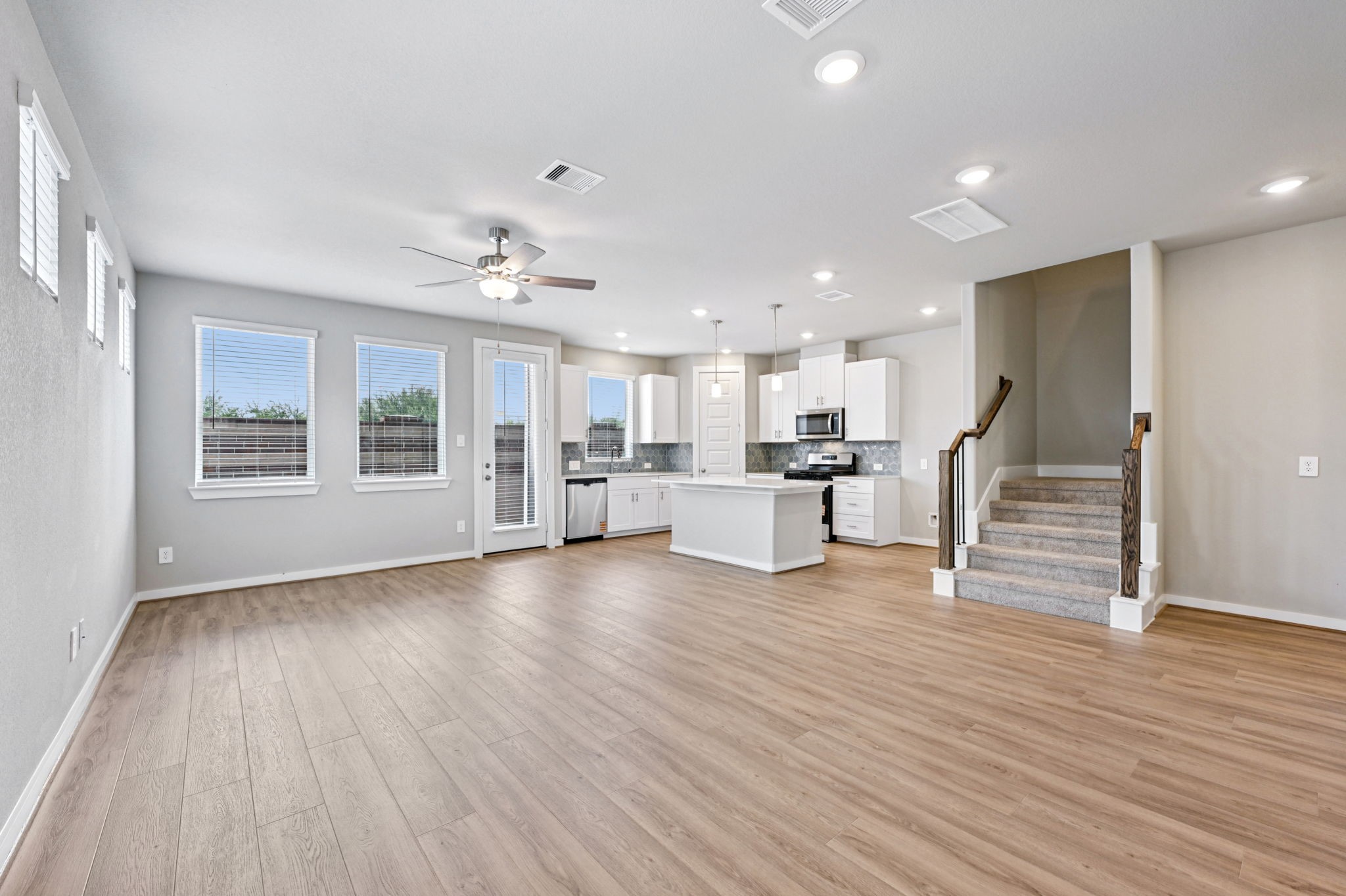 10032 Rustic Charm Street Houston, TX 77080 - Photo 14 of 40 a view of kitchen with wooden floor and windows