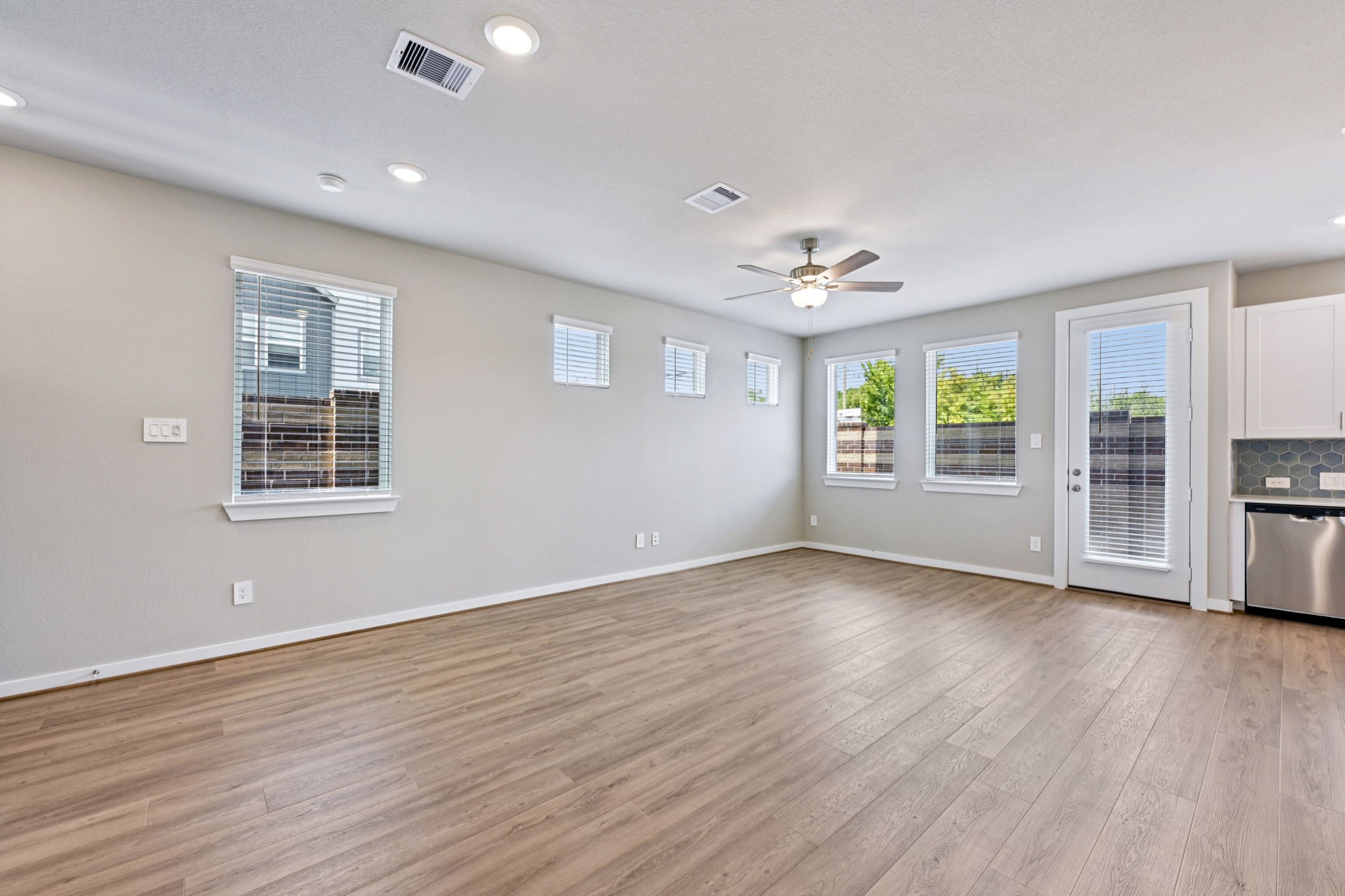 10032 Rustic Charm Street Houston, TX 77080 - Photo 16 of 40 a view of an empty room with a window and wooden floor