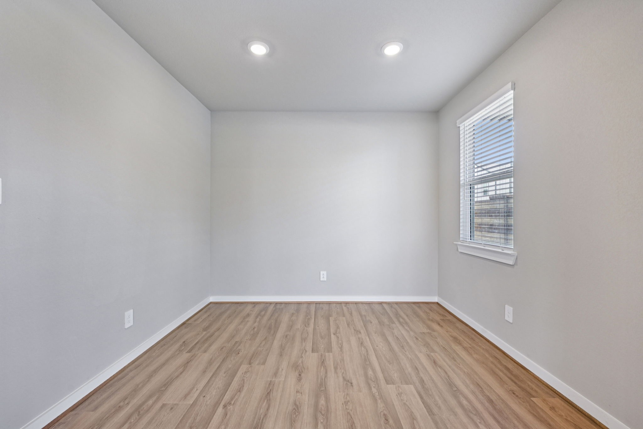 10032 Rustic Charm Street Houston, TX 77080 - Photo 17 of 40 a view of room with window and wooden floor