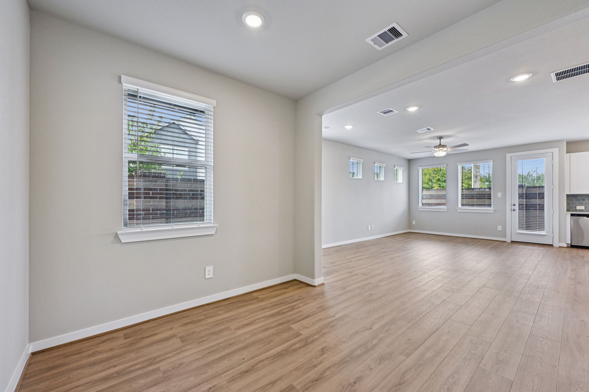 10032 Rustic Charm Street Houston, TX 77080 - Photo 19 of 40 a view of an empty room with a window and wooden floor
