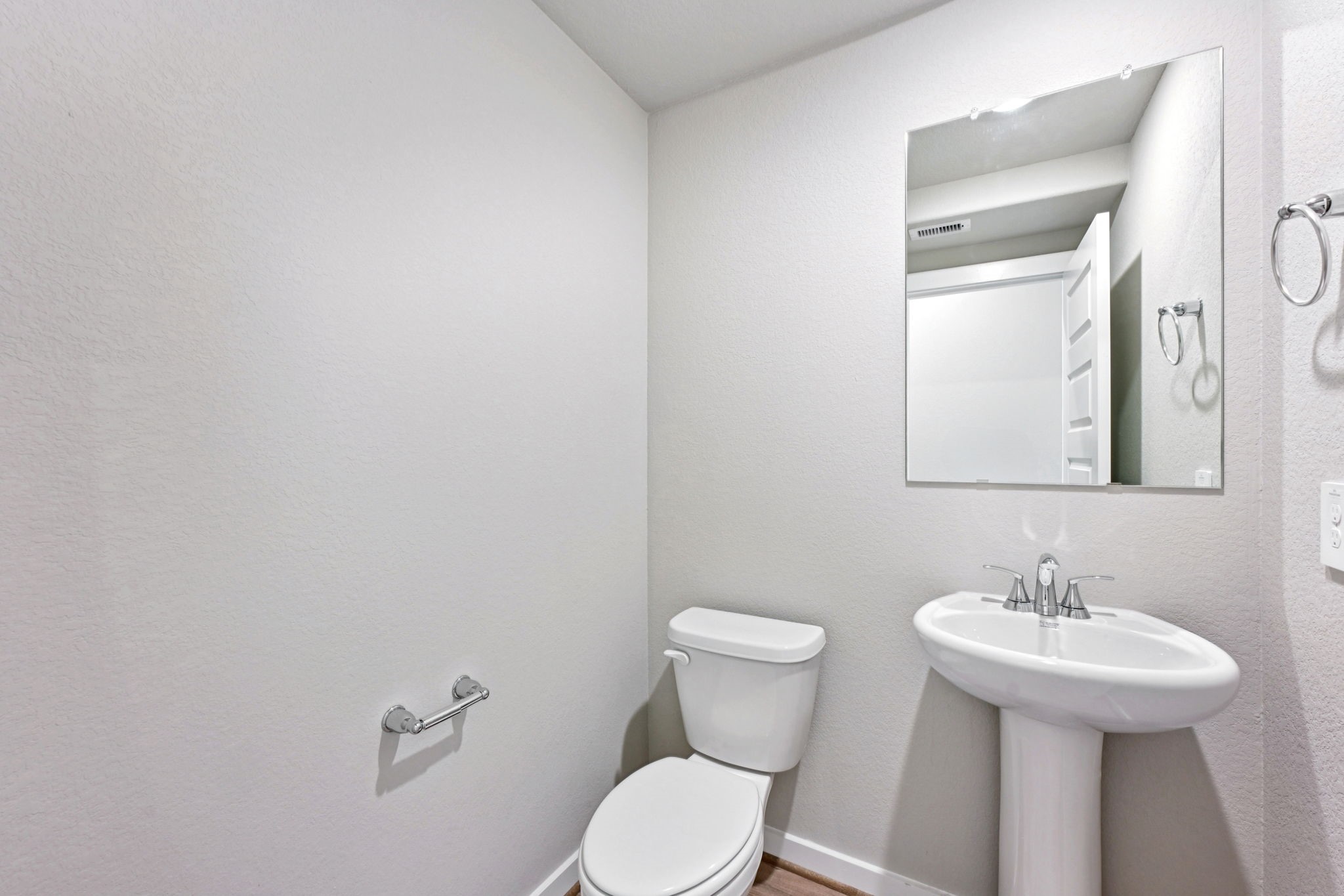 10032 Rustic Charm Street Houston, TX 77080 - Photo 20 of 40 a bathroom with a toilet sink and mirror