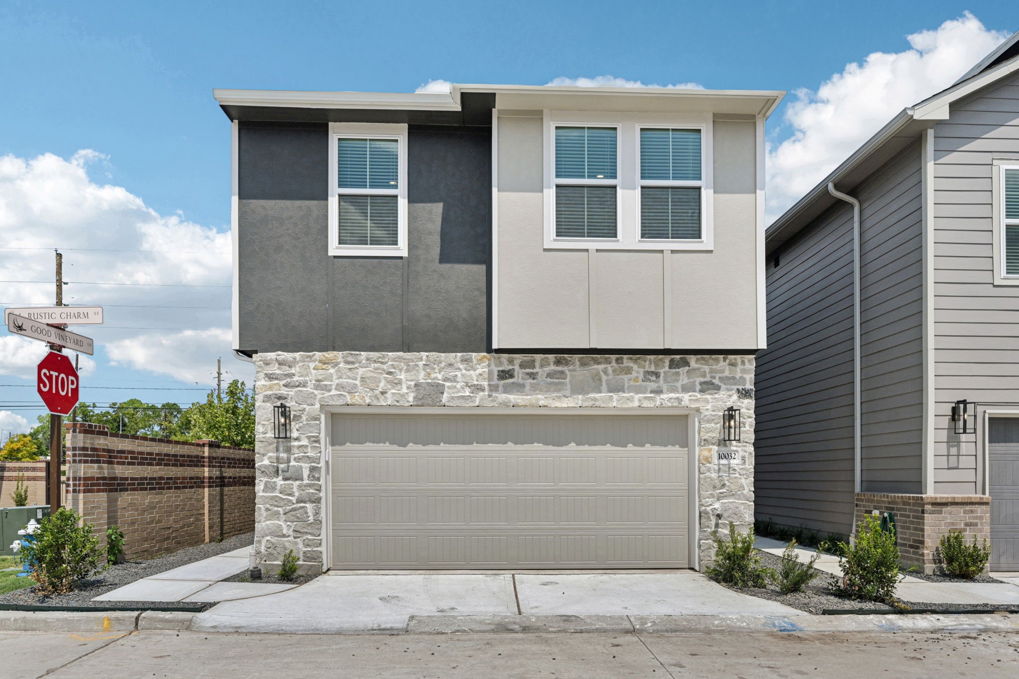 10032 Rustic Charm Street Houston, TX 77080 - Photo 2 of 40 a front view of a house with a yard