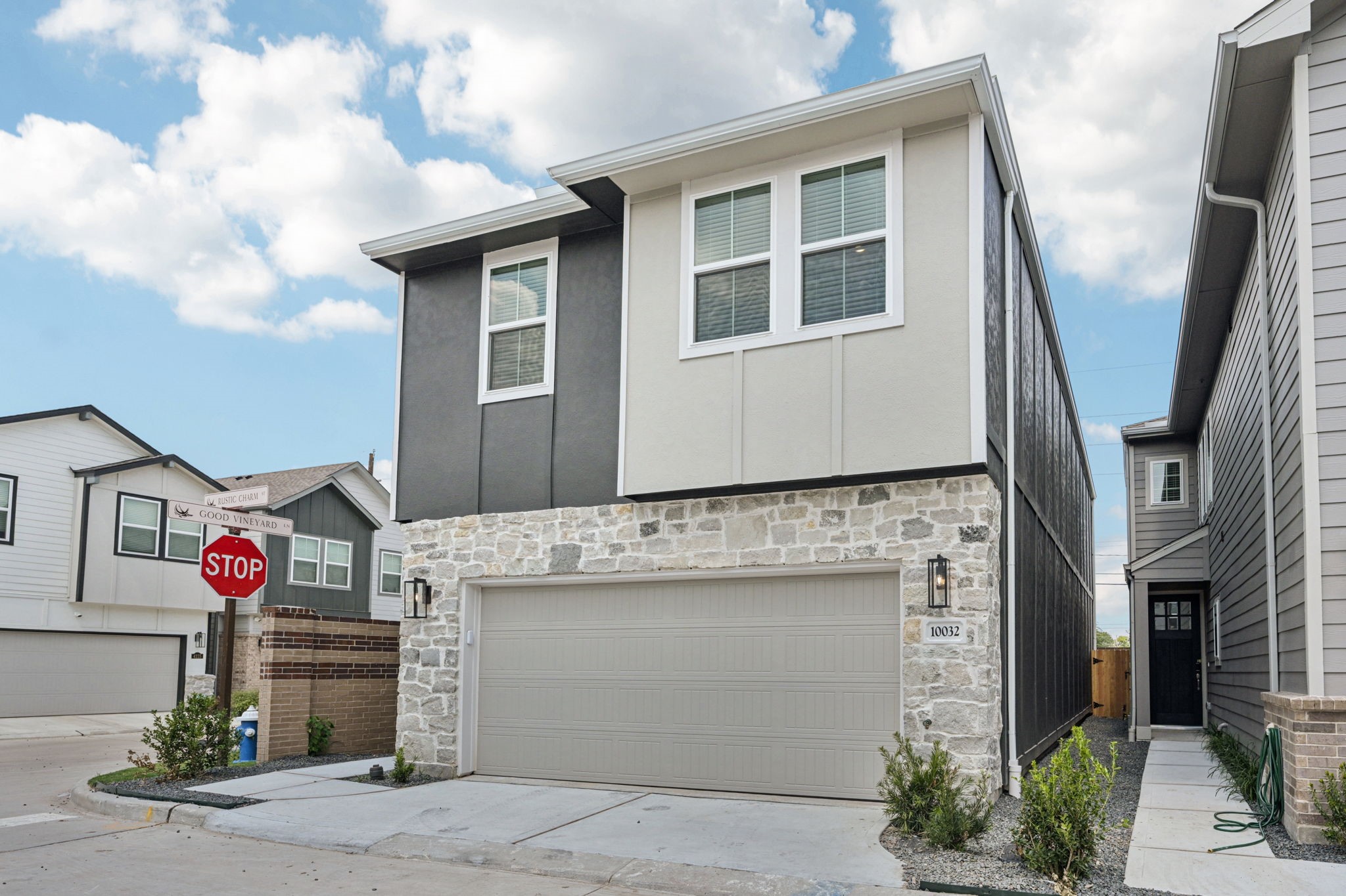 10032 Rustic Charm Street Houston, TX 77080 - Photo 39 of 40 a front view of a house with a garage