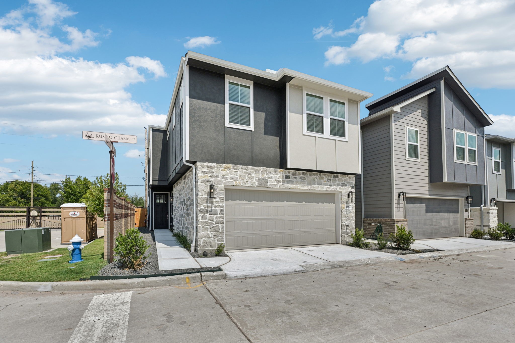 10032 Rustic Charm Street Houston, TX 77080 - Photo 40 of 40 a front view of a house with a yard and garage