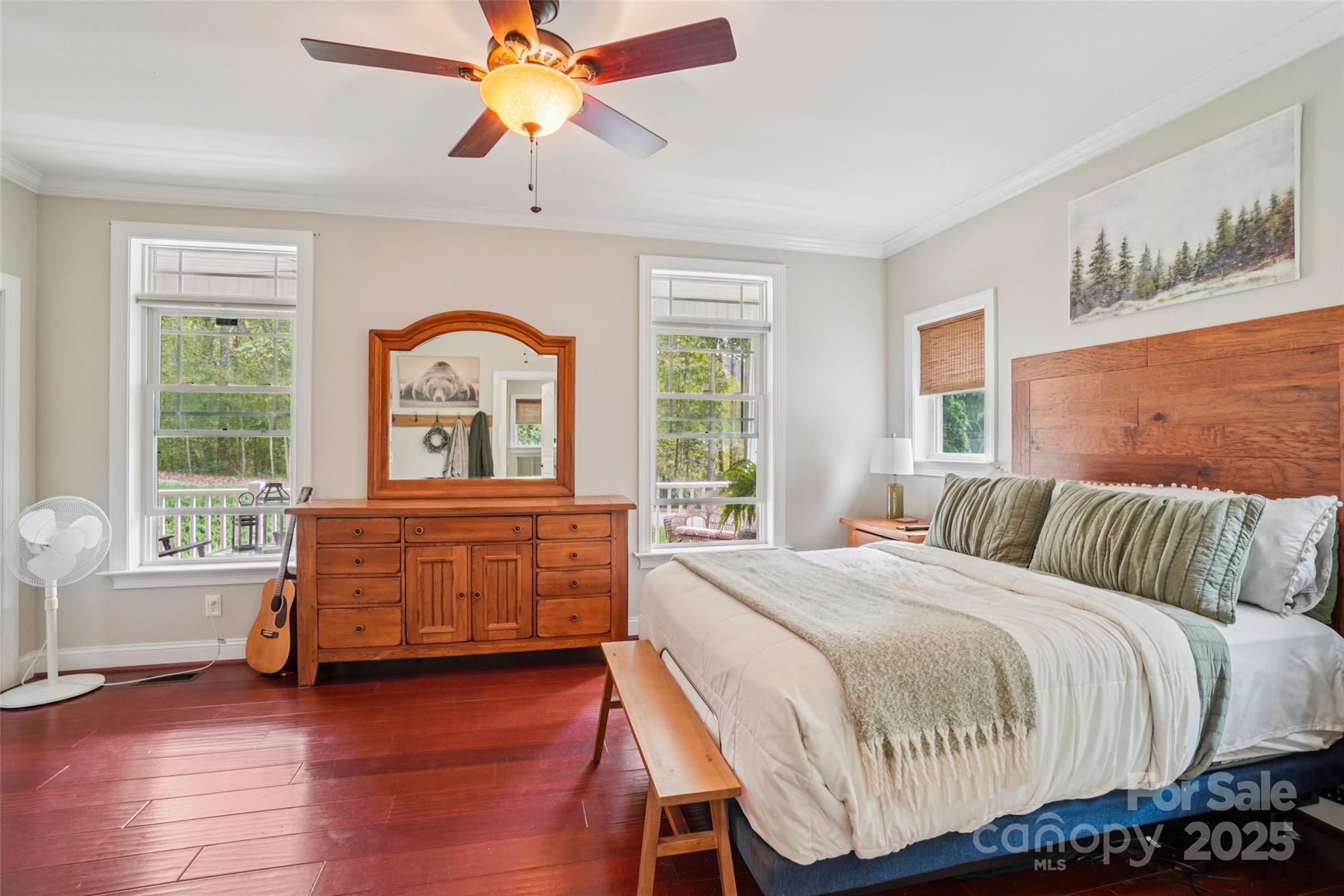 813 Beech Tree Place Hendersonville, NC 28792 - Photo 20 of 46 a bedroom with a bed and a dresser next to a window