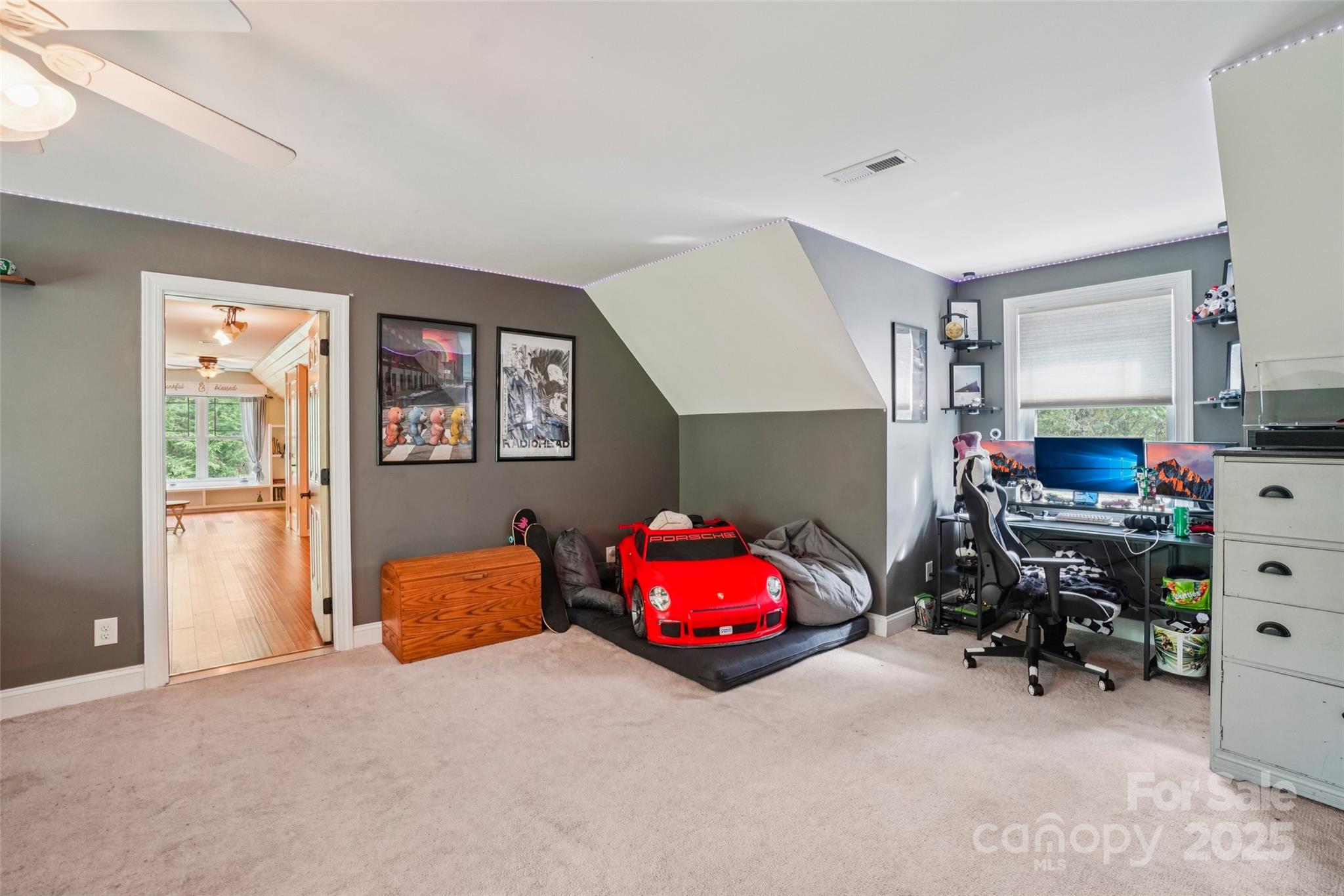 813 Beech Tree Place Hendersonville, NC 28792 - Photo 23 of 46 a bedroom with furniture and a flat screen tv