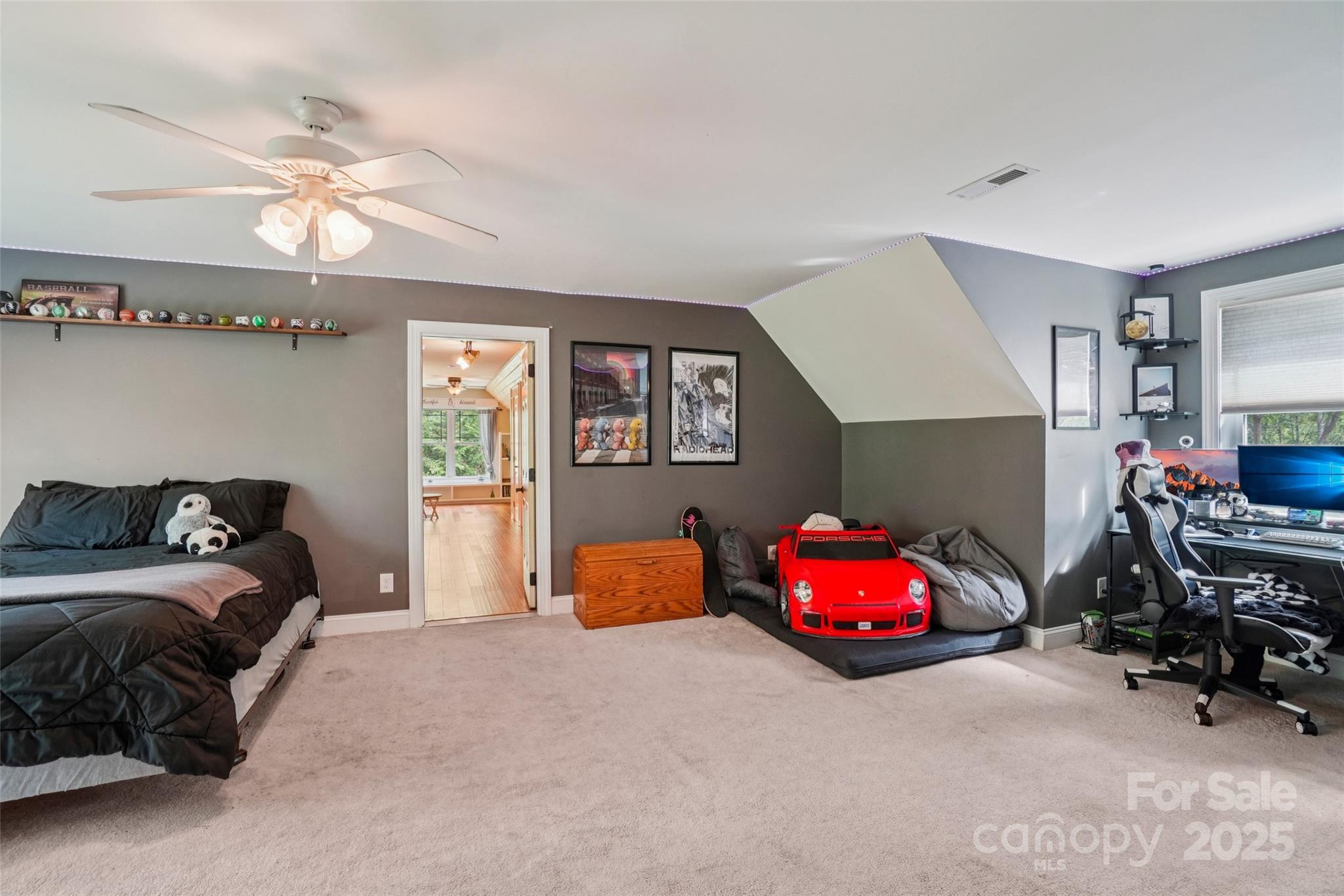 813 Beech Tree Place Hendersonville, NC 28792 - Photo 24 of 46 a bedroom with a bed and a chandelier