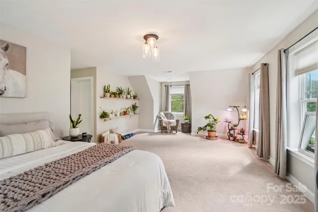 a bathroom with a granite countertop sink and a window