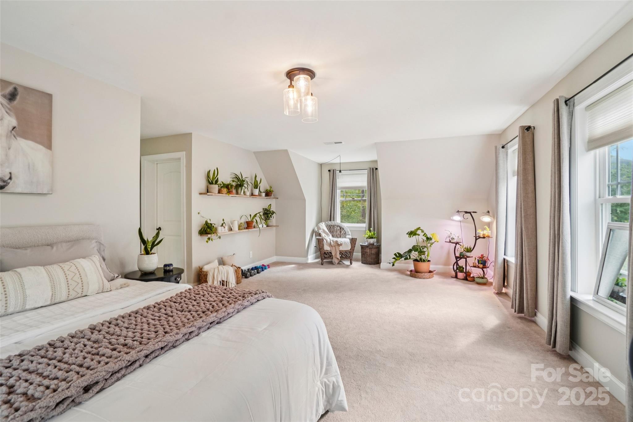 813 Beech Tree Place Hendersonville, NC 28792 - Photo 32 of 46 a bedroom with furniture and a large window