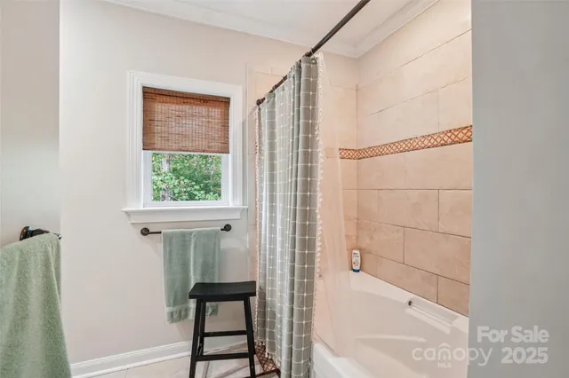 a view of storage and utility room with washer and dryer