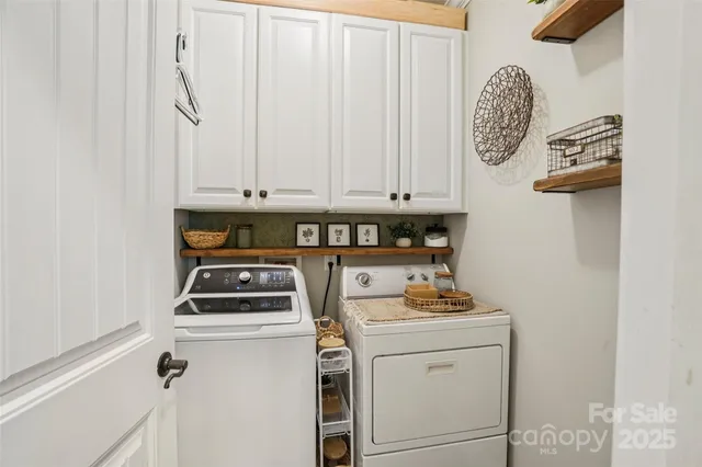 a bathroom with a granite countertop sink toilet and large mirror