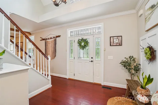 a view of an entryway with wooden floor