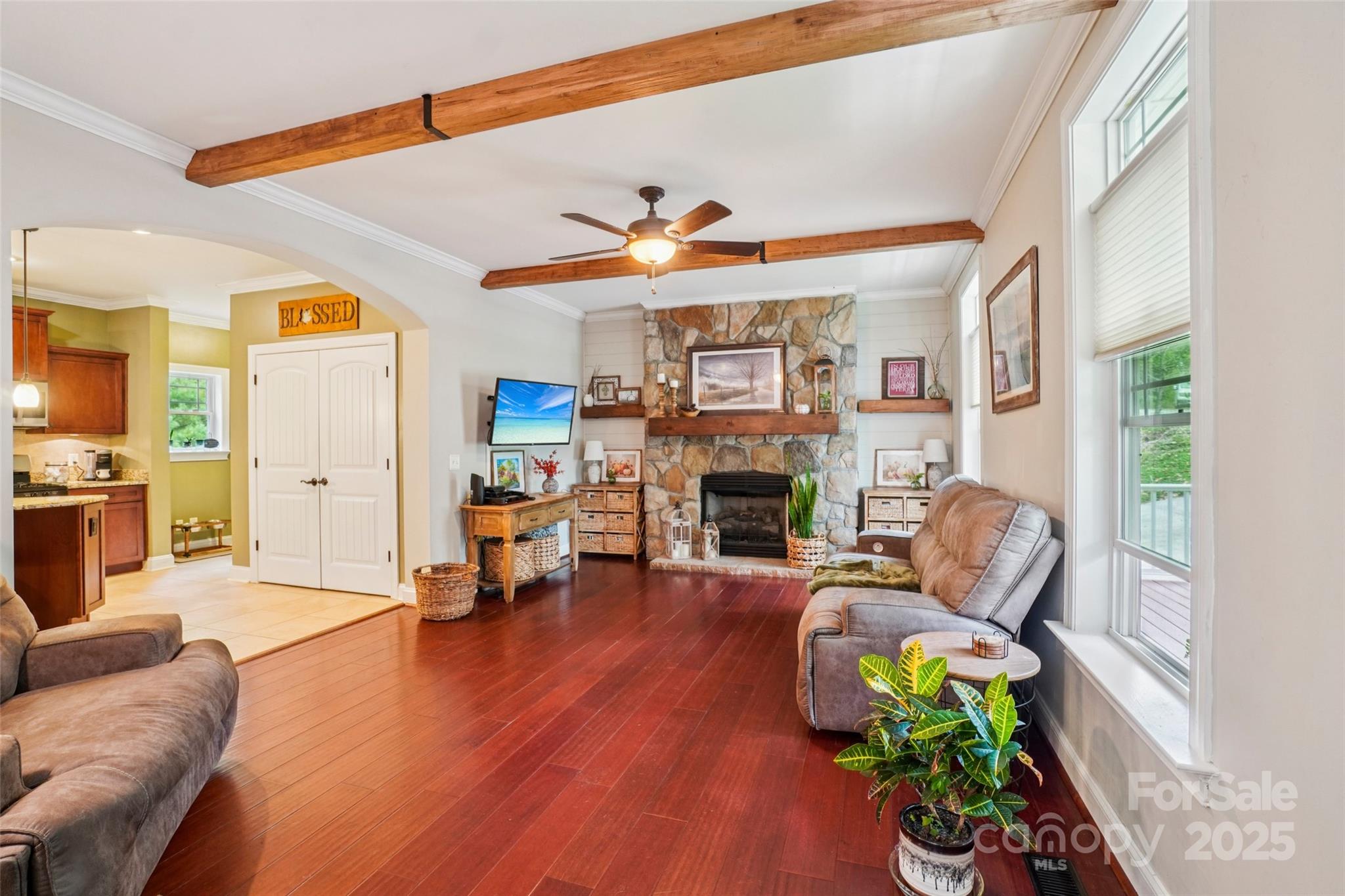 813 Beech Tree Place Hendersonville, NC 28792 - Photo 9 of 46 a living room with furniture a fireplace and a window