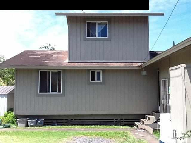 944 Kokomo Road Haiku, HI 96708 - Photo 7 of 11 a front view of a house with garden