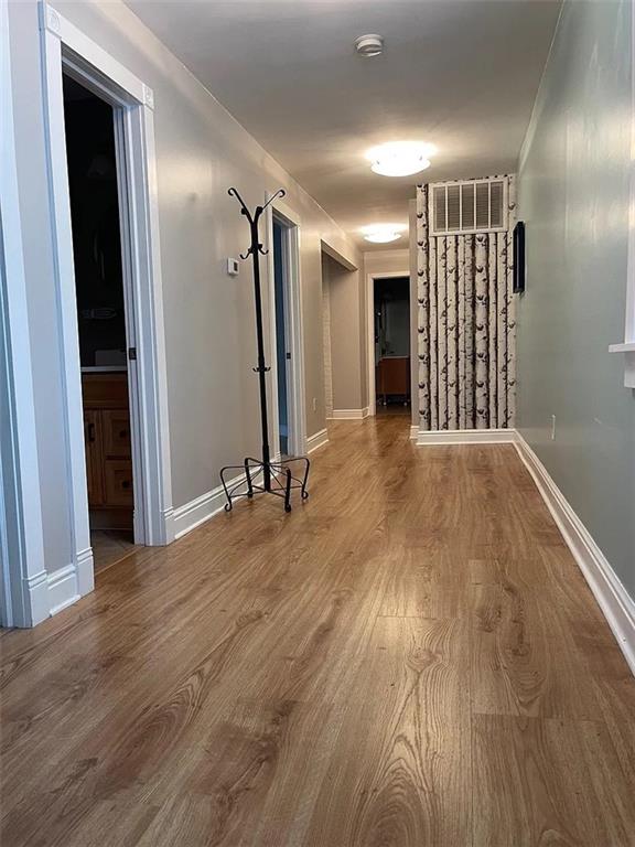 7115 Church Avenue, Unit 2 Pittsburgh, PA 15202 - Photo 13 of 17 a view of a hallway with wooden floor