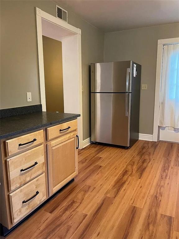 7115 Church Avenue, Unit 2 Pittsburgh, PA 15202 - Photo 2 of 17 a kitchen with a refrigerator and cabinets