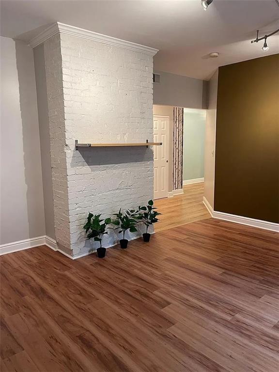7115 Church Avenue, Unit 2 Pittsburgh, PA 15202 - Photo 3 of 17 a view of an empty room with wooden floor and a window