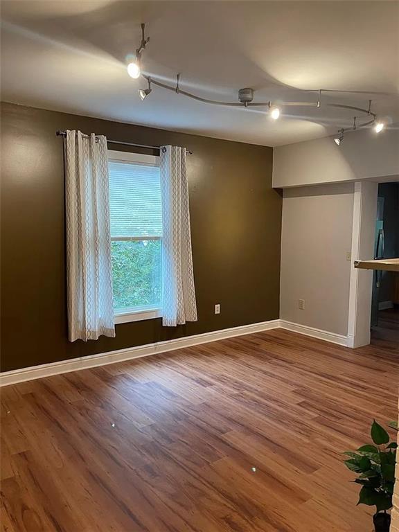 7115 Church Avenue, Unit 2 Pittsburgh, PA 15202 - Photo 4 of 17 a view of an empty room with wooden floor and a window