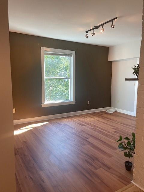 7115 Church Avenue, Unit 2 Pittsburgh, PA 15202 - Photo 5 of 17 a view of a livingroom with wooden floor and a window