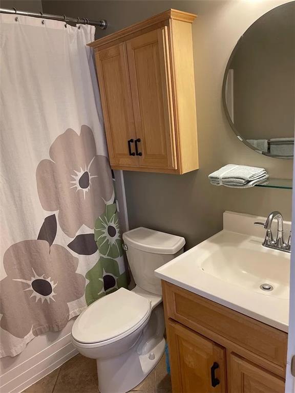7115 Church Avenue, Unit 2 Pittsburgh, PA 15202 - Photo 8 of 17 a bathroom with a sink a toilet and a mirror