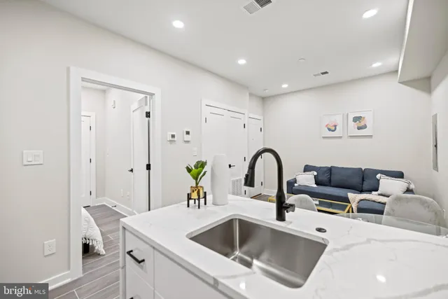 a bedroom with a bed and a mirror