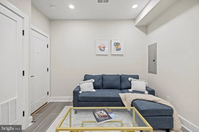a kitchen with stainless steel appliances kitchen island a refrigerator sink and cabinets