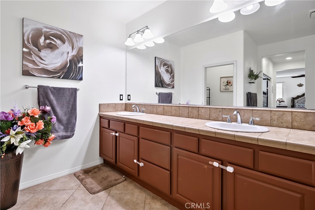 32001 Whitetail Lane Temecula, CA 92592 - Photo 19 of 28 a spacious bathroom with a sink double vanity and a mirror