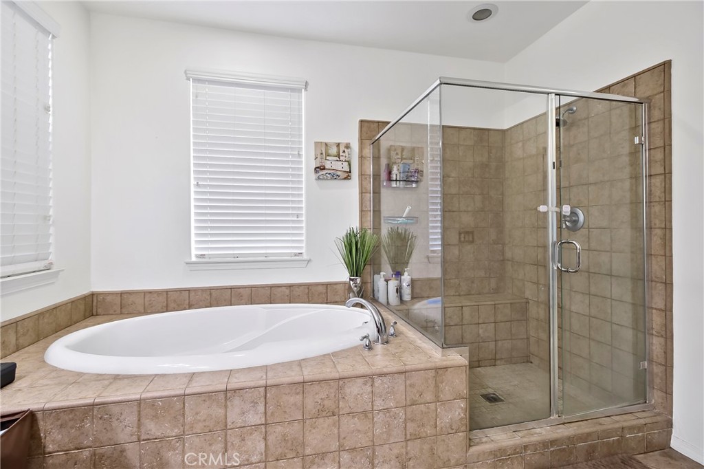 32001 Whitetail Lane Temecula, CA 92592 - Photo 20 of 28 a bathroom with a shower and a bathtub
