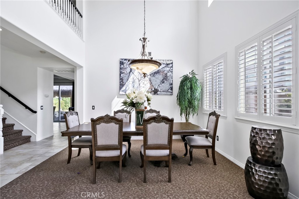 32001 Whitetail Lane Temecula, CA 92592 - Photo 7 of 28 a view of a dining room with furniture window and wooden floor