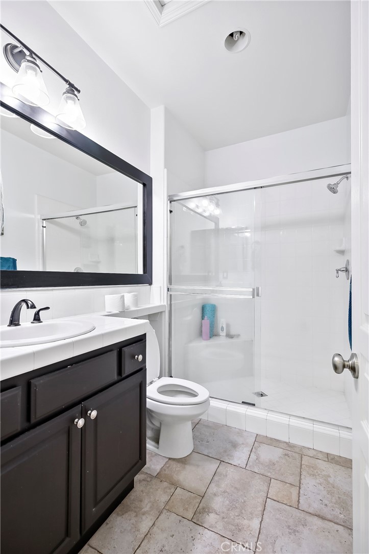 32001 Whitetail Lane Temecula, CA 92592 - Photo 10 of 28 a bathroom with a sink a toilet and mirror