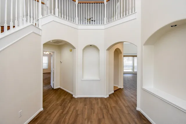 a view of entryway with wooden floor