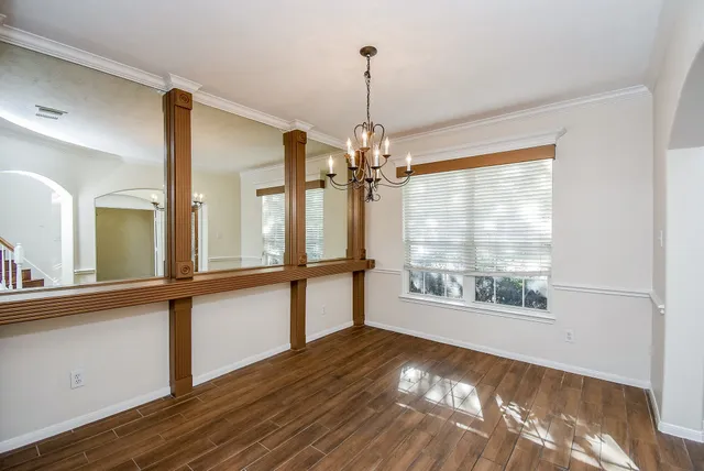 a view of a room with window and wooden floor