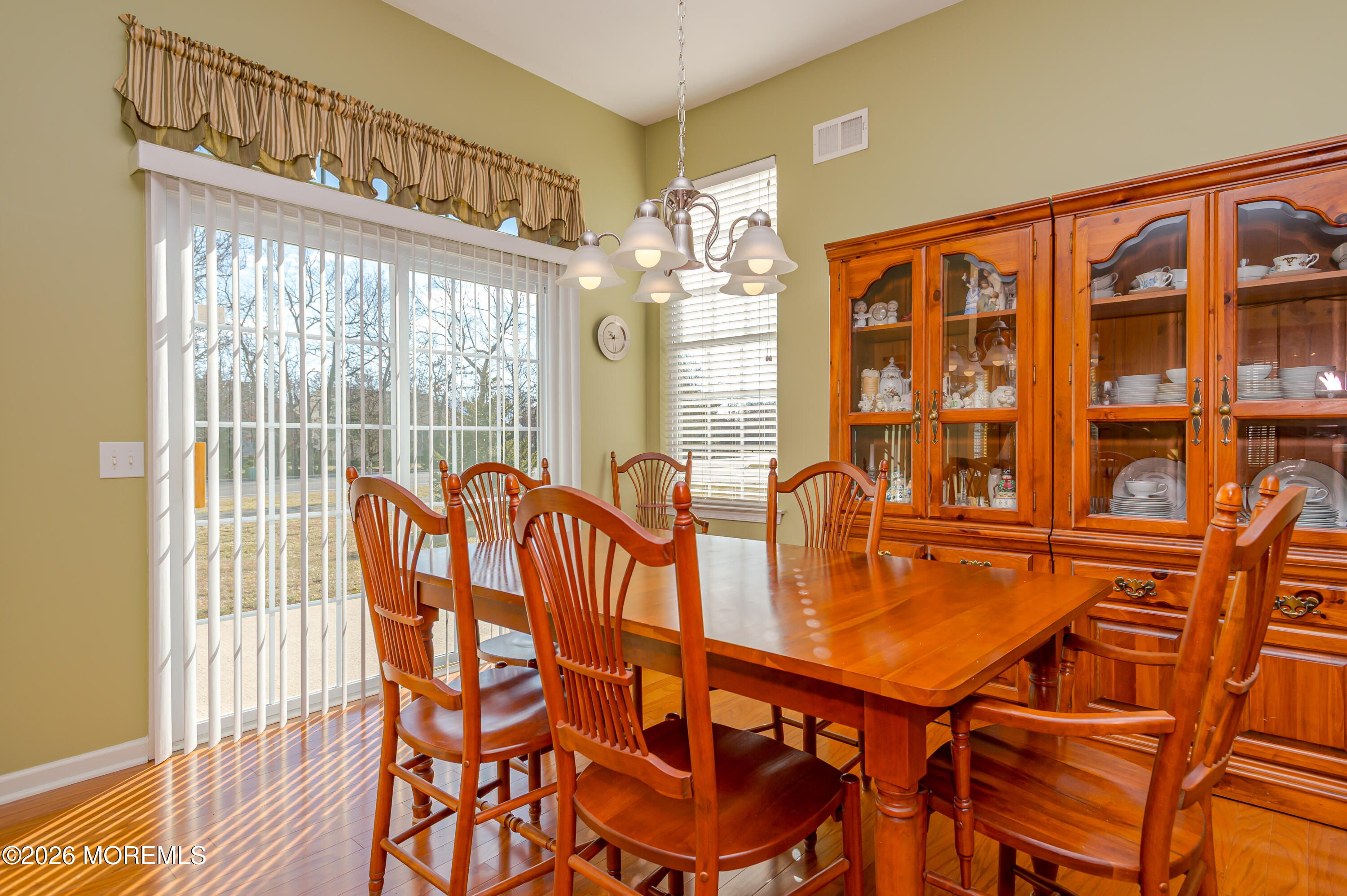 21 Sawgrass Street Jackson, NJ 08527 - Photo 14 of 23 a dining room with furniture a chandelier and wooden floor