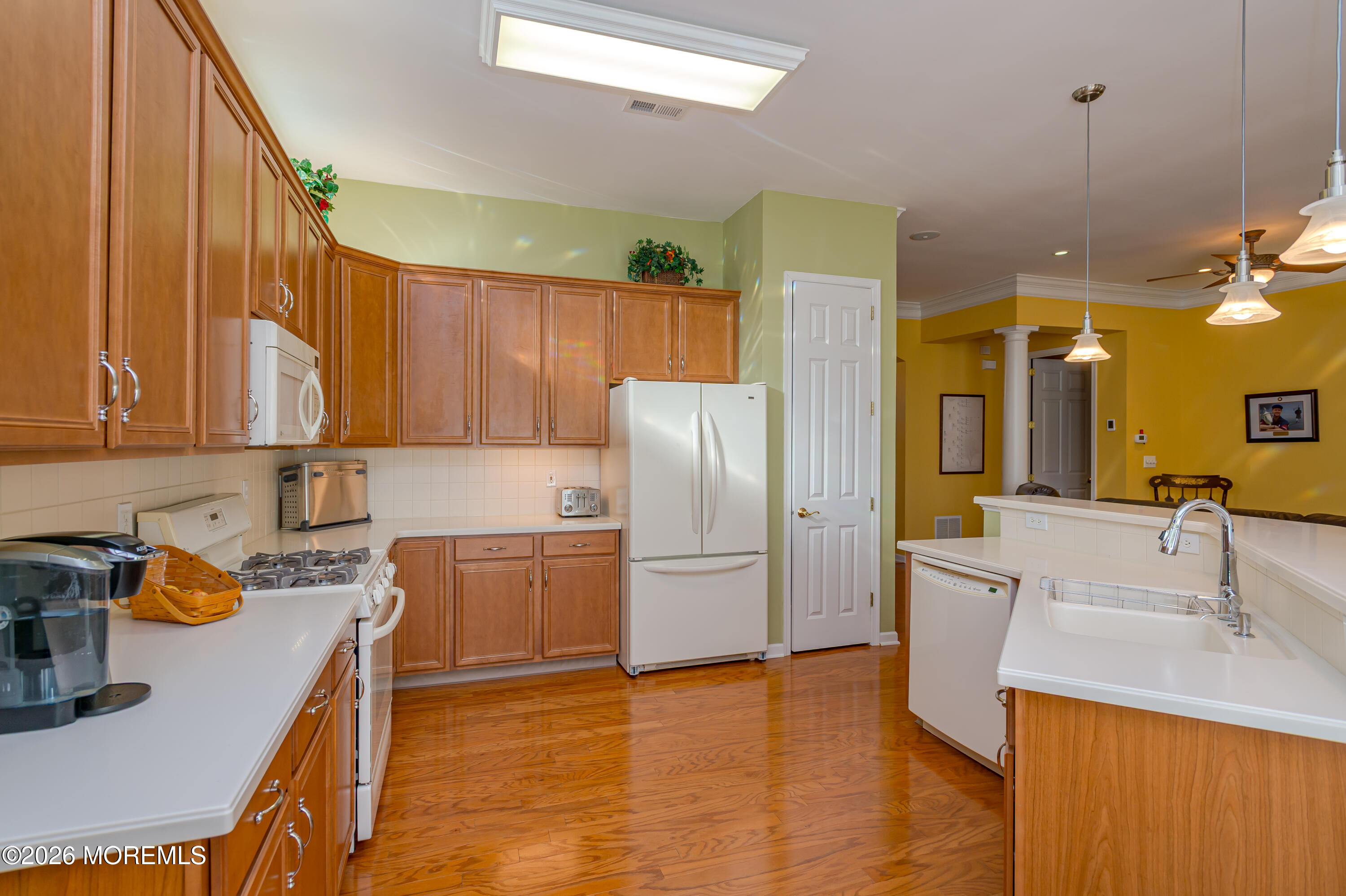 21 Sawgrass Street Jackson, NJ 08527 - Photo 16 of 23 a kitchen with a sink appliances and cabinets