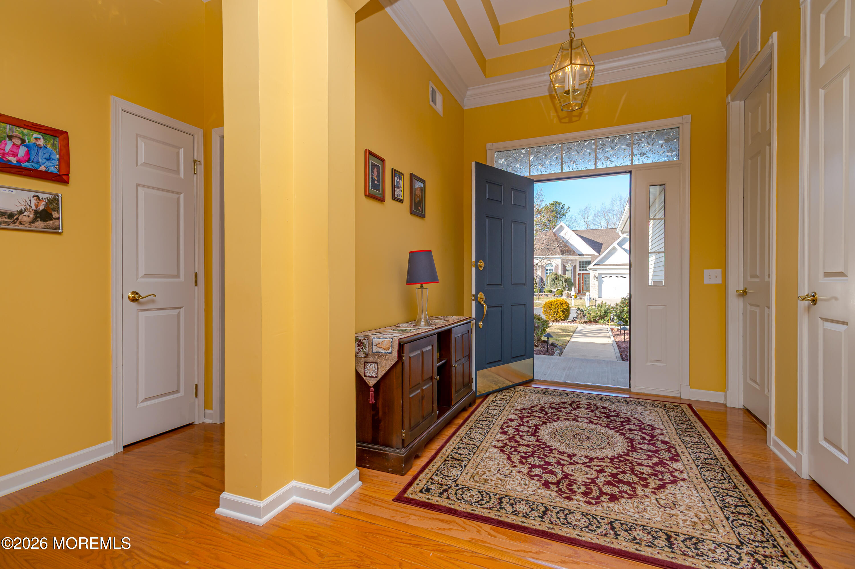 21 Sawgrass Street Jackson, NJ 08527 - Photo 6 of 23 a view of a hallway to a livingroom with furniture