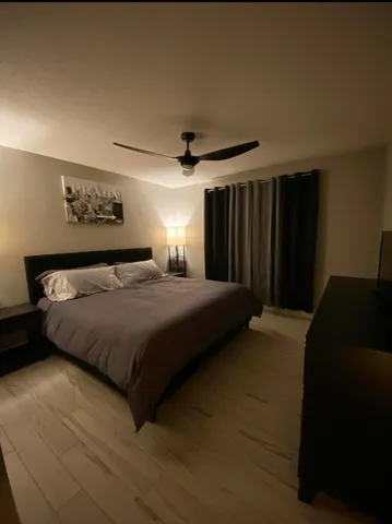 a bedroom with a bed and a walk in closet