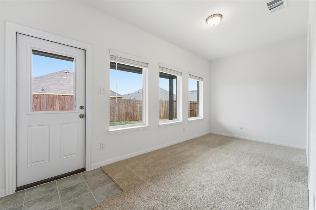 232 Triple Crown Road Waxahachie, TX 75165 - Photo 13 of 22 an empty room with windows and closet
