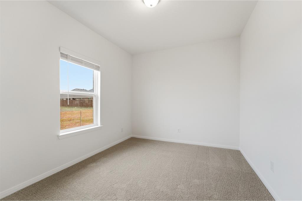 232 Triple Crown Road Waxahachie, TX 75165 - Photo 19 of 22 a view of an empty room with a window