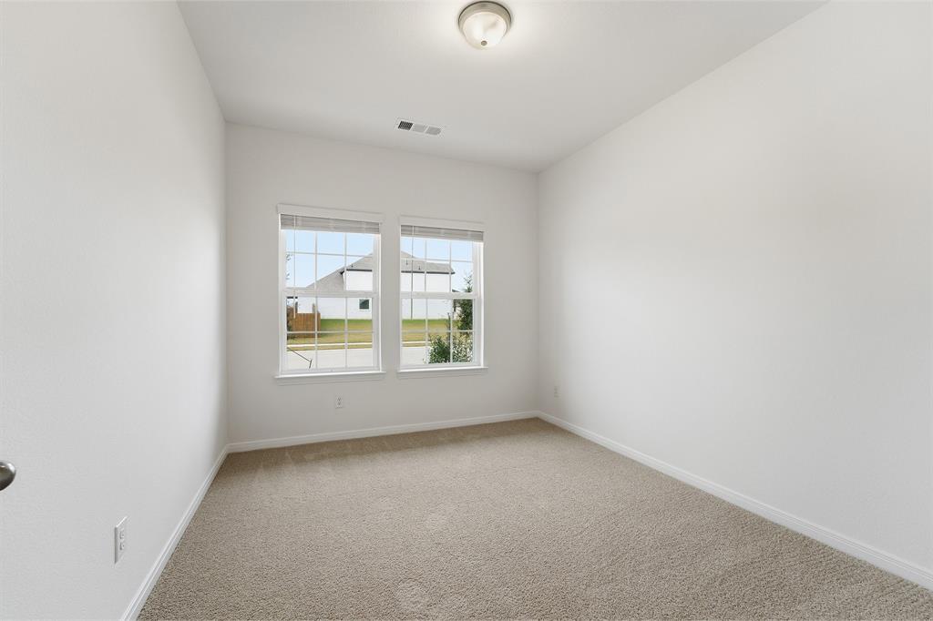 232 Triple Crown Road Waxahachie, TX 75165 - Photo 20 of 22 an empty room with a window